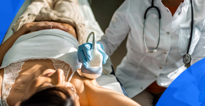 Patient getting a breast exam