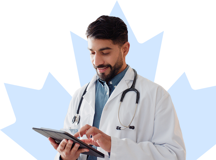 Physician smiles in front of a maple leaf background while looking down at their tablet.