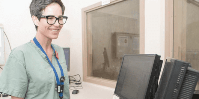 Nurse prepares to upload xray