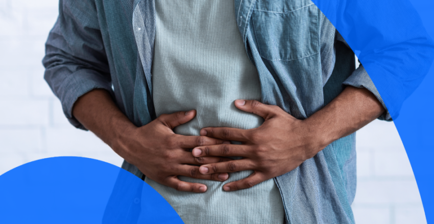 Man putting hands on stomach in pain